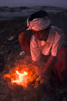 Bali - Boy making fire