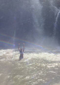 Bali - Dancing in the middle of the rainbow under a waterfall